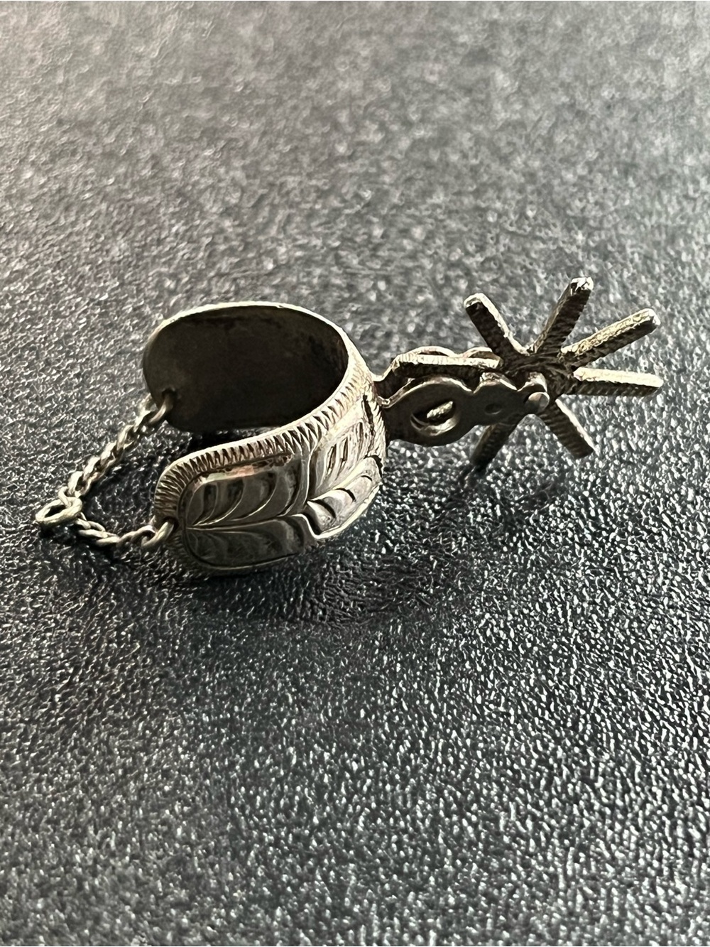 Sterling silver spur charm/pendant. Back Piece spins. 2 tone. Mexico.